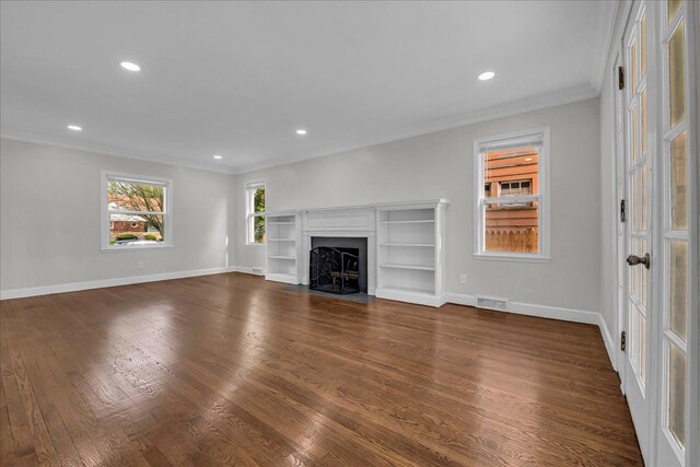 16585 Sunderland Rd, Detroit, MI 48219 - unfurnished living room featuring ornamental molding, dark wood-style flooring, baseboards, a fireplace with flush hearth, and recessed lighting