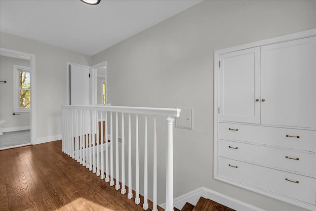 16585 Sunderland Rd, Detroit, MI 48219 - corridor with baseboards, wood finished floors, and an upstairs landing