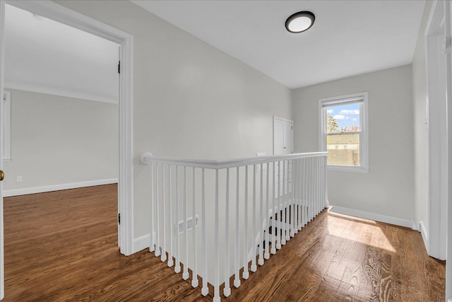 16585 Sunderland Rd, Detroit, MI 48219 - hallway featuring wood finished floors, an upstairs landing, and baseboards