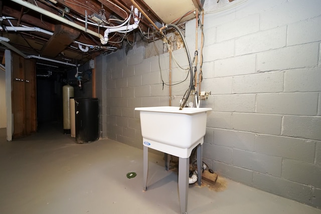 unfinished below grade area featuring a water softener system