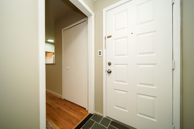 28407 Milton Ave, Warren, MI 48092 - entryway featuring dark wood-style flooring and baseboards