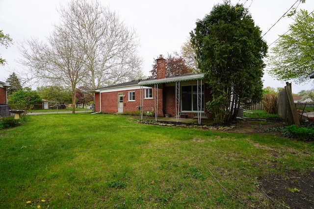 28407 Milton Ave, Warren, MI 48092 - rear view of property with brick siding and a chimney