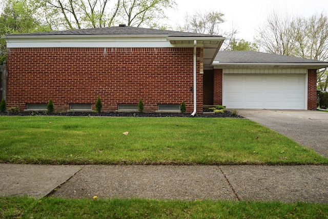 28407 Milton Ave, Warren, MI 48092 - view of front of home featuring asphalt driveway, a front yard, a garage, and brick siding