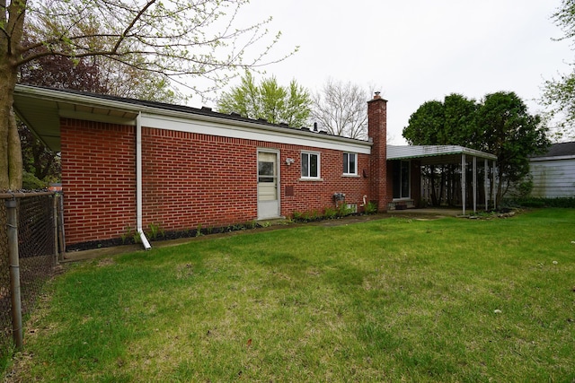 28407 Milton Ave, Warren, MI 48092 - back of house with a chimney and brick siding
