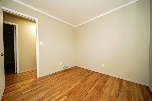 28407 Milton Ave, Warren, MI 48092 - spare room featuring light wood-type flooring, baseboards, and crown molding