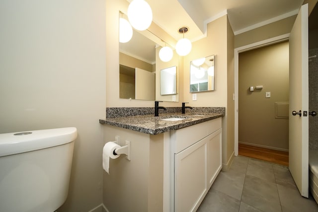28407 Milton Ave, Warren, MI 48092 - bathroom with toilet, tile patterned floors, crown molding, vanity, and baseboards
