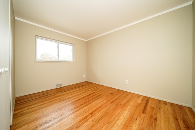 28407 Milton Ave, Warren, MI 48092 - empty room featuring crown molding, light wood finished floors, and baseboards