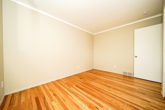 28407 Milton Ave, Warren, MI 48092 - spare room with ornamental molding, light wood finished floors, and baseboards