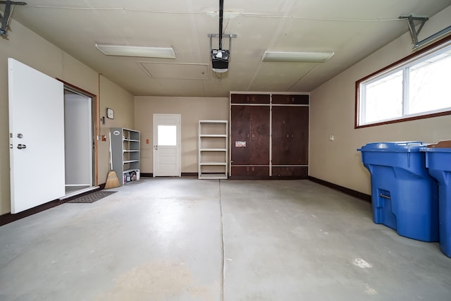 28407 Milton Ave, Warren, MI 48092 - garage with a garage door opener and baseboards