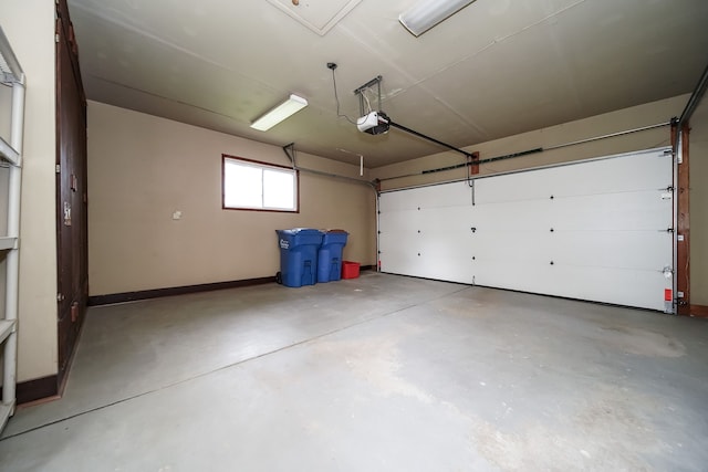28407 Milton Ave, Warren, MI 48092 - garage with a garage door opener and baseboards