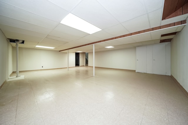 28407 Milton Ave, Warren, MI 48092 - finished basement with a drop ceiling, baseboards, and tile patterned floors
