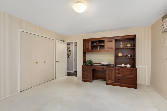 home office featuring light colored carpet and baseboards