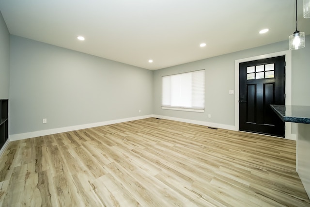 34067 Chatsworth Dr, Sterling Heights, MI 48312 - unfurnished living room with plenty of natural light, light wood-style flooring, baseboards, and recessed lighting
