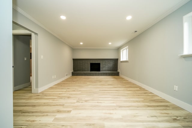 34067 Chatsworth Dr, Sterling Heights, MI 48312 - basement with light wood finished floors, recessed lighting, a brick fireplace, baseboards, and ornamental molding