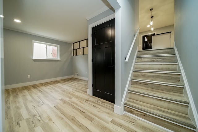 34067 Chatsworth Dr, Sterling Heights, MI 48312 - staircase with wood finished floors, baseboards, and arched walkways