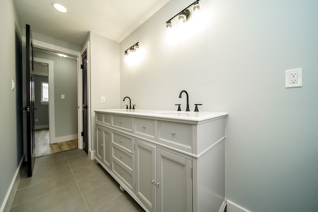 34067 Chatsworth Dr, Sterling Heights, MI 48312 - full bathroom with baseboards, tile patterned floors, and double vanity