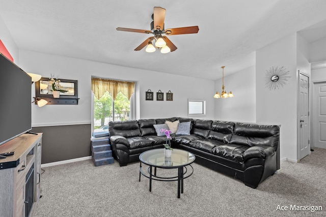 living room with carpet flooring, a chandelier, ceiling fan, and baseboards