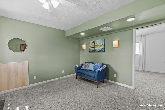 living area with carpet, ceiling fan, a textured ceiling, baseboards, and recessed lighting