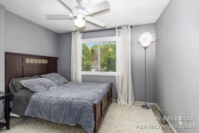 bedroom with baseboards and a ceiling fan
