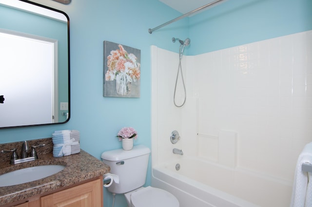bathroom with vanity, toilet, and shower / tub combination