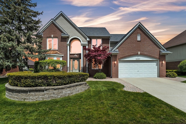 20261 Ramblewood Dr, Macomb, MI 48044 - traditional-style home with brick siding, concrete driveway, an attached garage, and a front lawn