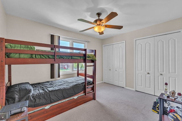 20261 Ramblewood Dr, Macomb, MI 48044 - bedroom featuring multiple closets, carpet, a ceiling fan, and baseboards