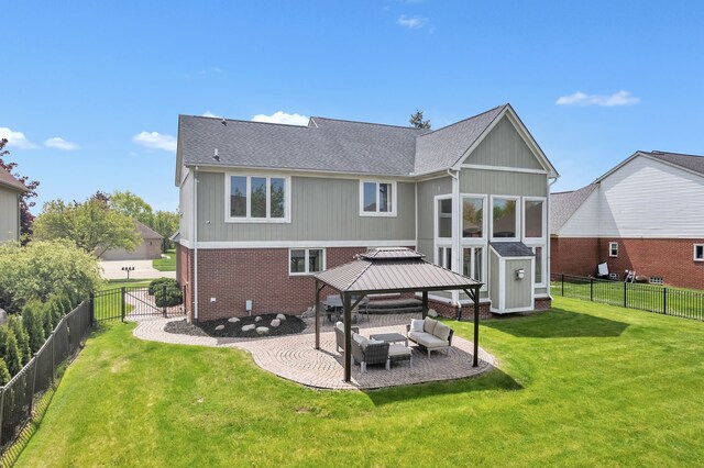 20261 Ramblewood Dr, Macomb, MI 48044 - back of house featuring a gazebo, brick siding, a patio area, an outdoor hangout area, and a shingled roof