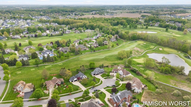 aerial view of residential area with a large body of water and a local golf course