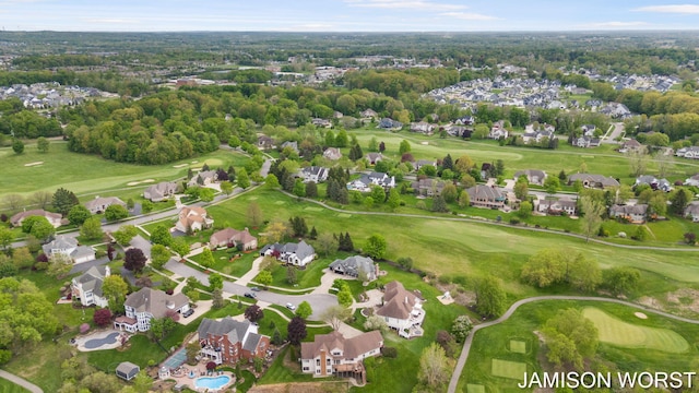 aerial view of residential area with a local golf course