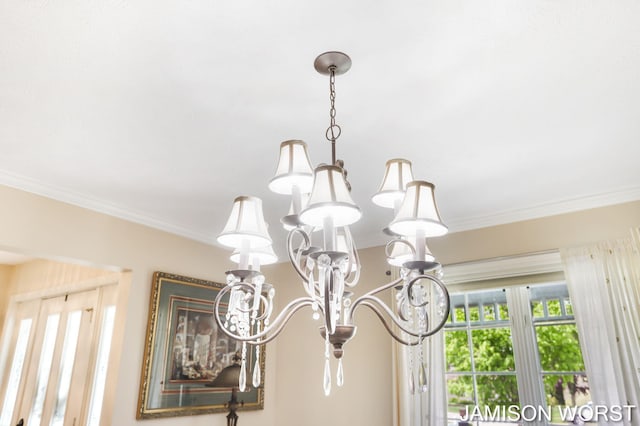 detailed view of a chandelier and ornamental molding