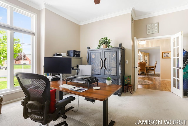 carpeted office with crown molding, french doors, baseboards, and ceiling fan