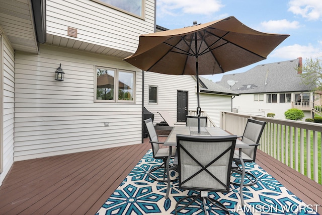 wooden deck with outdoor dining area