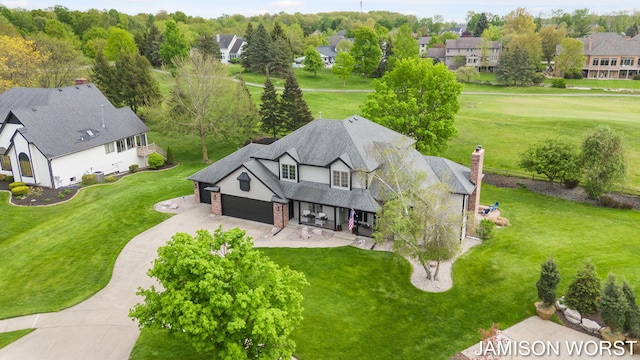 aerial view of residential area with a local golf course