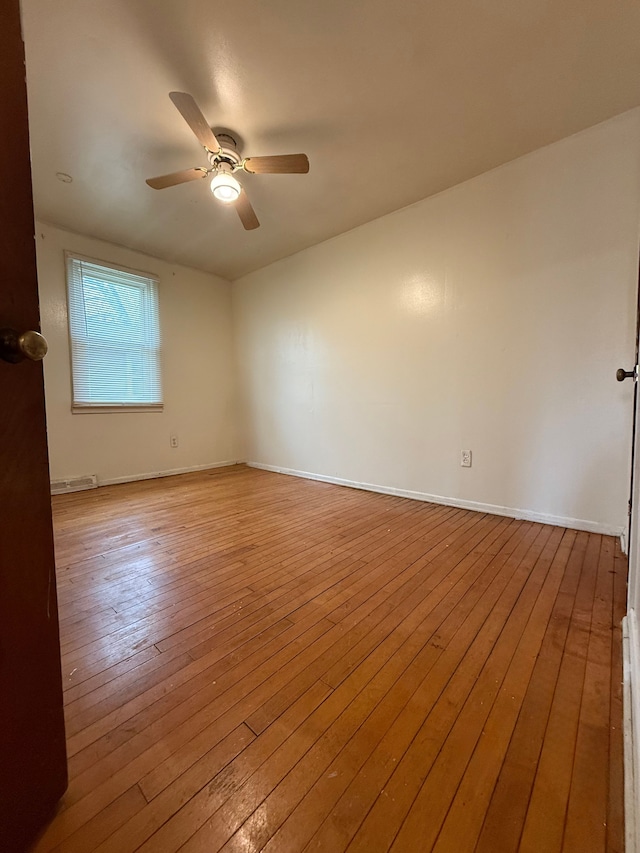 206 Frazier St, River Rouge, MI 48218 - empty room with a ceiling fan, hardwood / wood-style floors, and baseboards