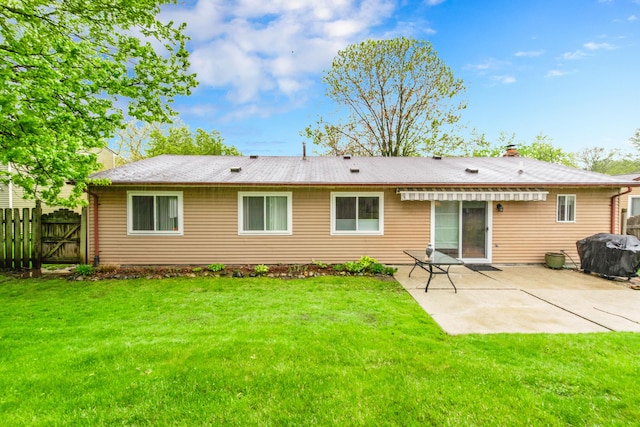 24459 Surfside Rd, Novi, MI 48374 - back of house featuring a patio area, a gate, and a chimney