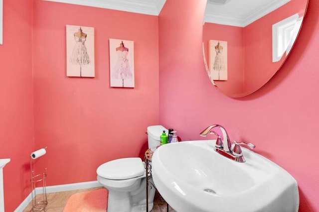 24459 Surfside Rd, Novi, MI 48374 - bathroom with a sink, crown molding, toilet, baseboards, and tile patterned flooring