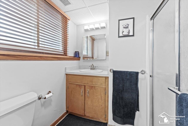 full bath featuring toilet, an enclosed shower, and vanity