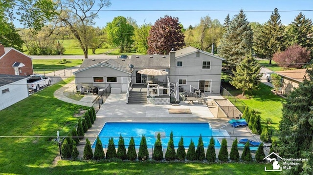 rear view of property featuring a patio