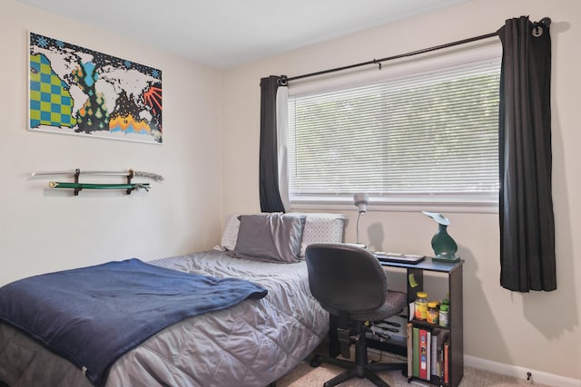 carpeted bedroom with baseboards
