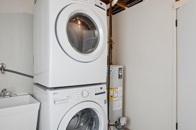 laundry area featuring stacked washer and clothes dryer and gas water heater