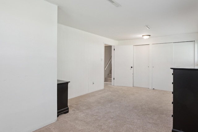 interior space with carpet floors and two closets