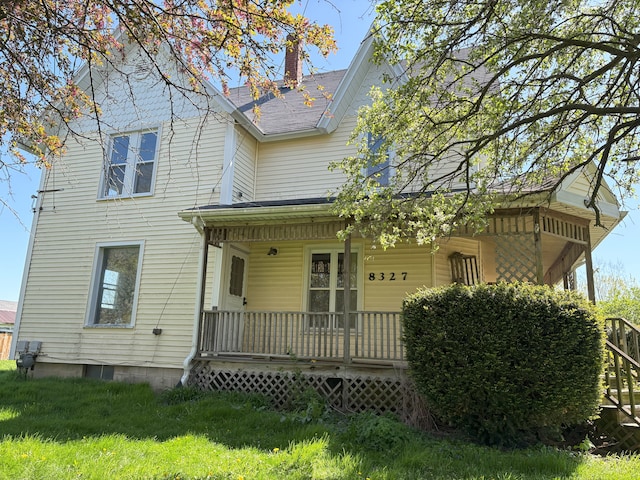 8327 Duffield Rd, Gaines, MI 48436 - back of property with a porch and a chimney