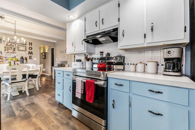kitchen featuring stainless steel range with electric stovetop, under cabinet range hood, backsplash, and light countertops