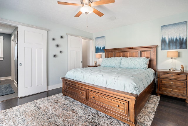 3080 Silver Fir Ct, Holland, MI 49424 - bedroom featuring baseboards, dark wood finished floors, and ceiling fan