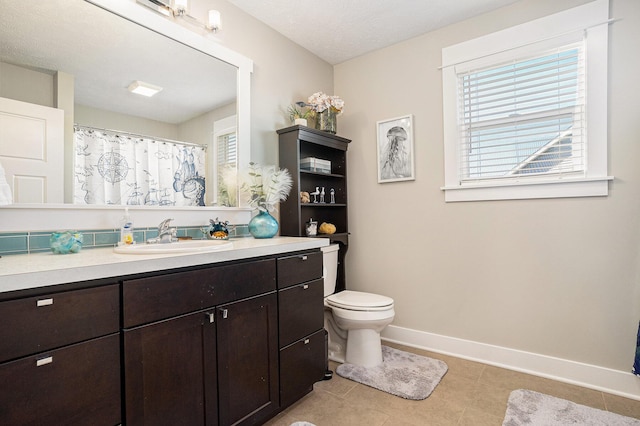 3080 Silver Fir Ct, Holland, MI 49424 - bathroom featuring baseboards, tile patterned floors, vanity, toilet, and a shower with curtain