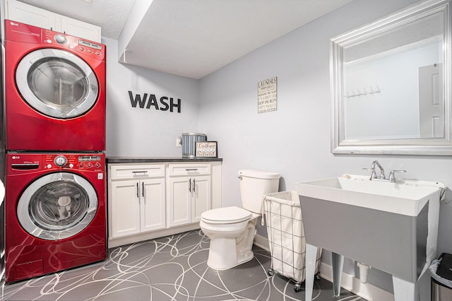 3080 Silver Fir Ct, Holland, MI 49424 - bathroom with stacked washer / drying machine, toilet, and vanity