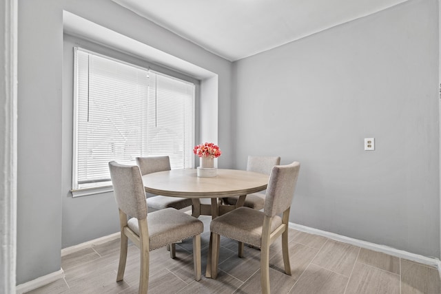 9327 Prest St, Detroit, MI 48228 - dining area with baseboards and light wood-style floors