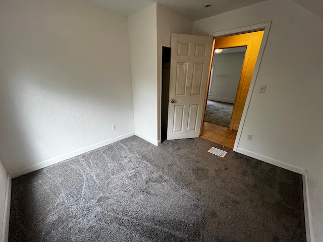 63 Hamilton St, Pontiac, MI 48342 - unfurnished bedroom with carpet and baseboards