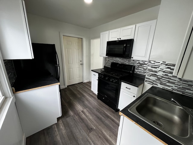 63 Hamilton St, Pontiac, MI 48342 - kitchen featuring black appliances, a sink, dark countertops, and white cabinets