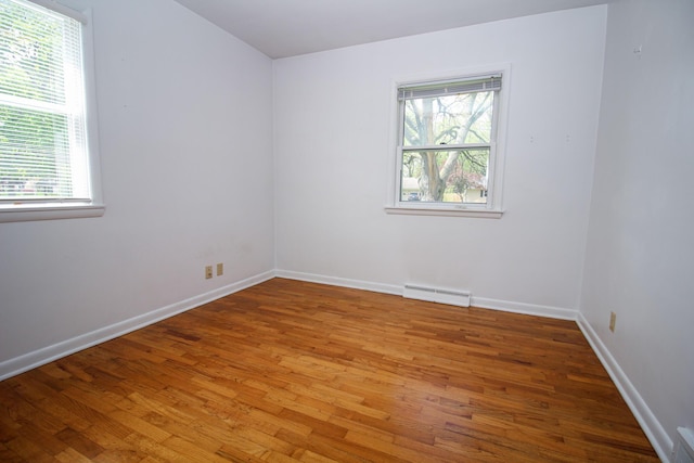 6339 Westchester St, Portage, MI 49024 - unfurnished room with wood finished floors, baseboards, and baseboard heating